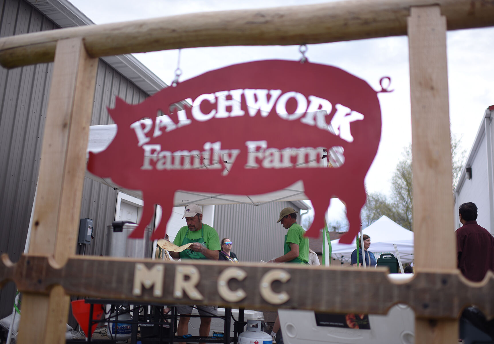 Employees of the Fresh Harvest Grill cook food on Thursday